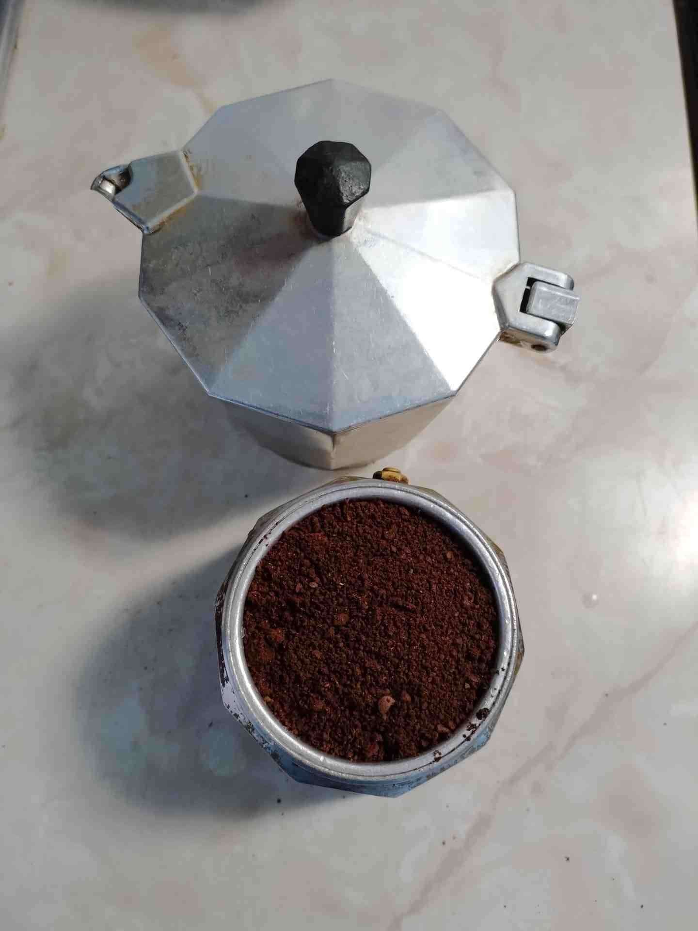 Moka pot brewing coffee at home